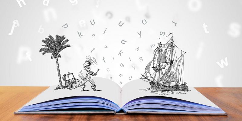 livre ouvert avec bateau et pirate sur les feuilles