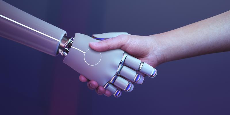 Poignée de mains entre un robot et un humain
